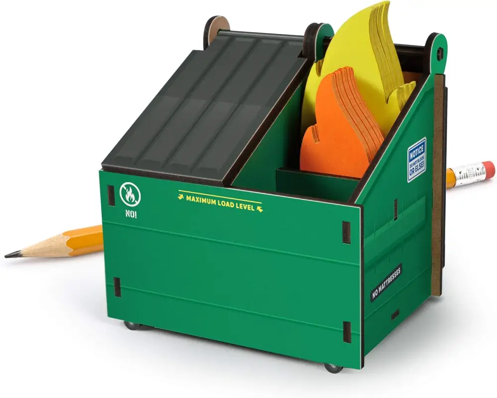 Green dumpster-shaped pencil and pen holder with flame-shaped notepads, perfect for office humor and desk organization.