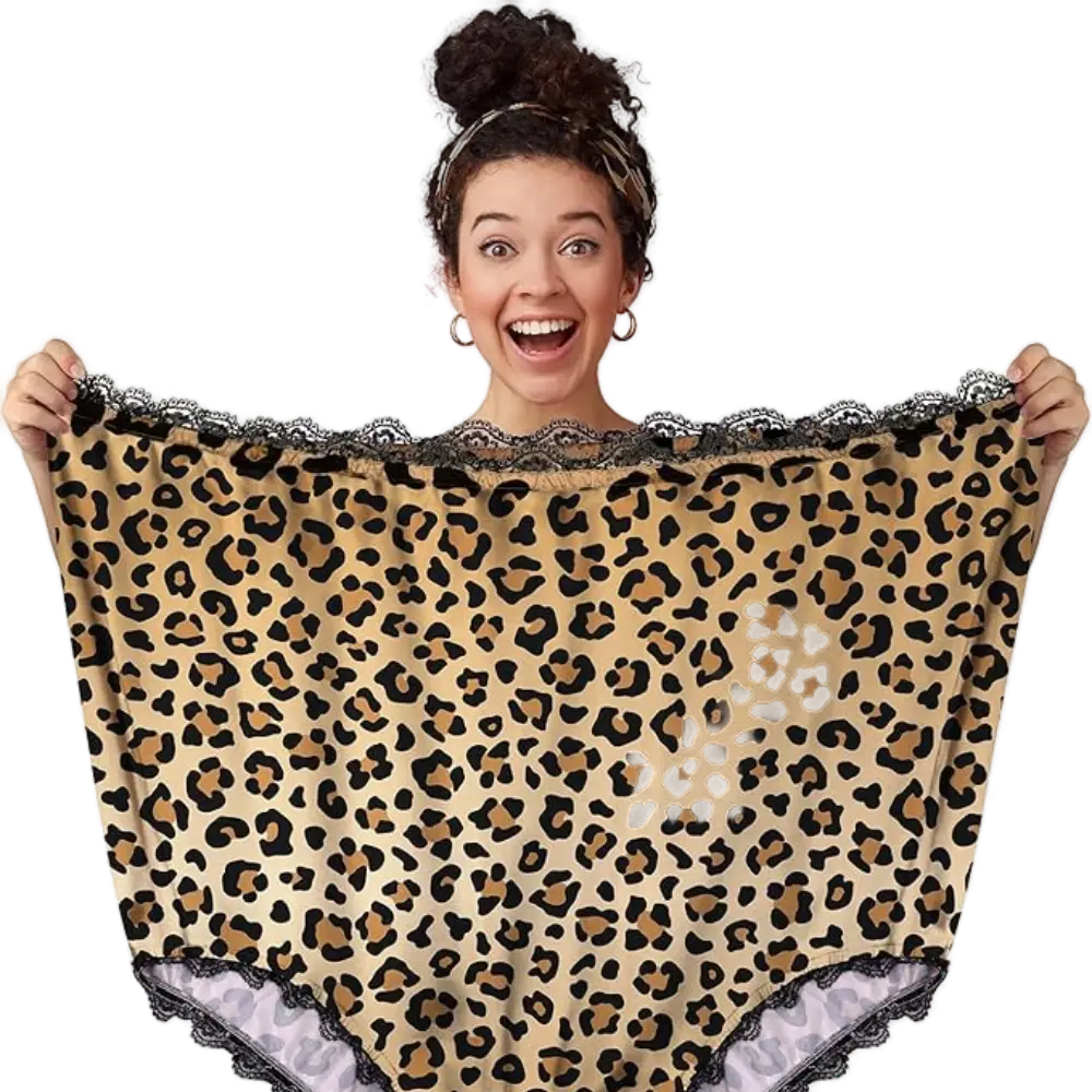 Smiling woman holding an oversized pair of leopard-print gag gift panties with lace trim, perfect for humorous occasions.